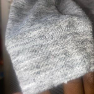 Extra small ‘Sweater’ from NOBO with pink, gray and black exterior colors.